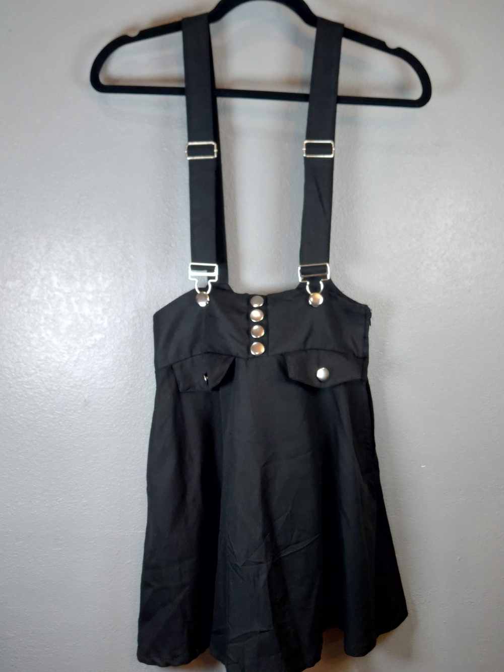Black High-Waisted Suspender Skirt By Hot Topic.